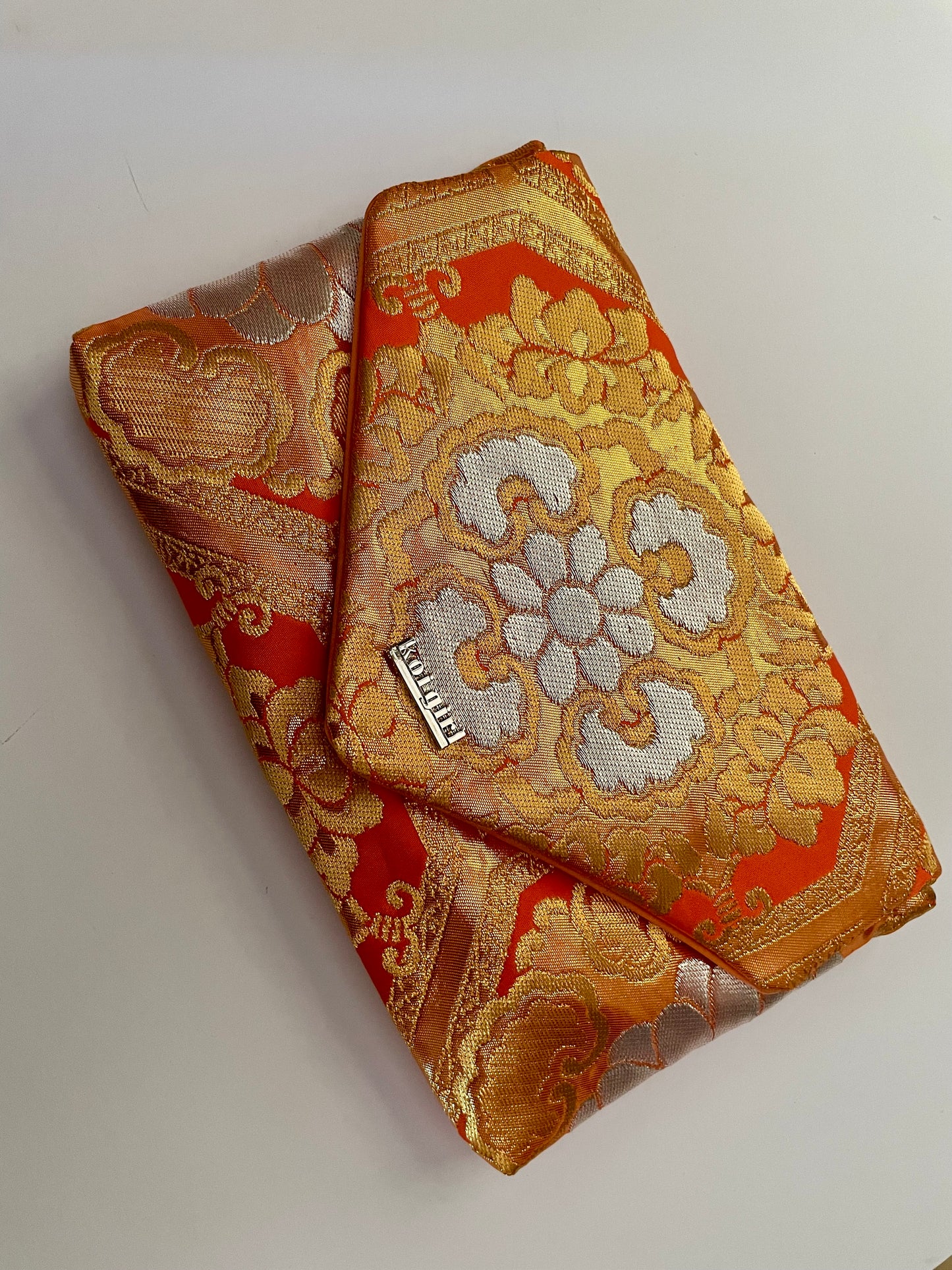 Salmon Pink Geometric Floral Clutch